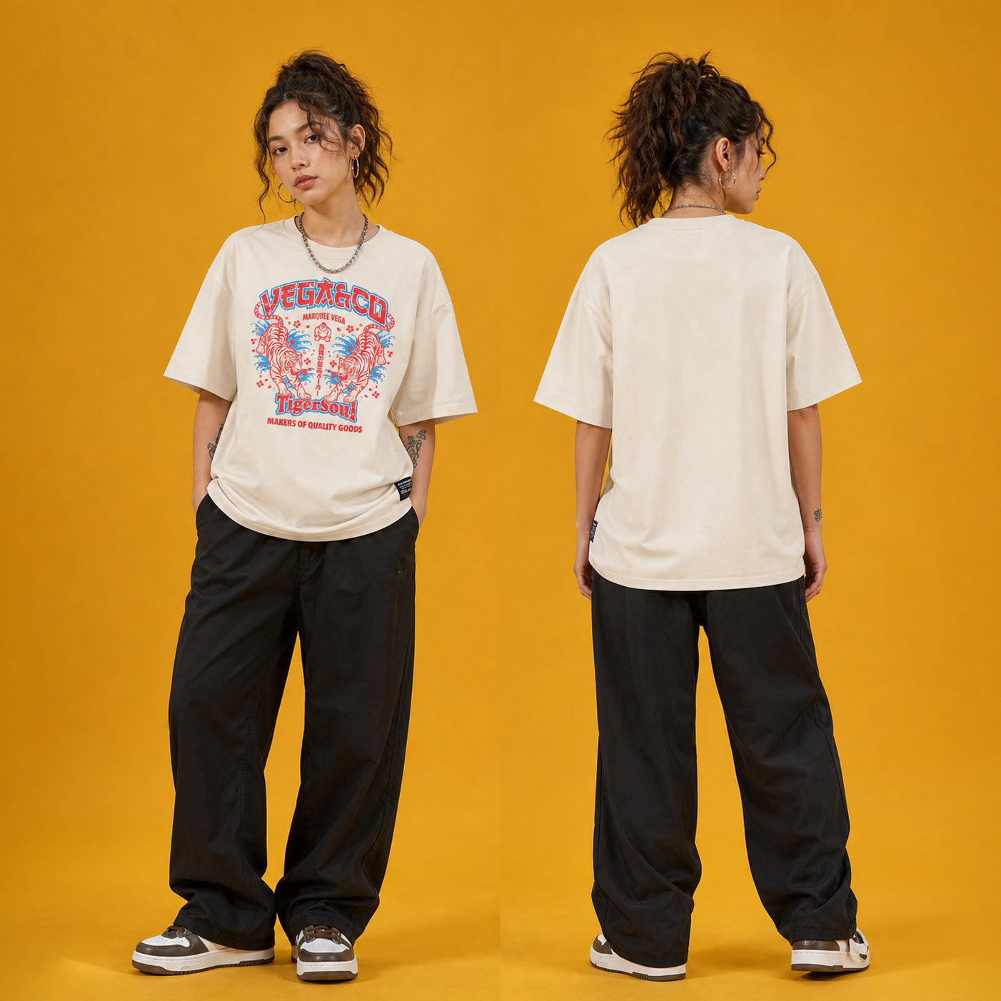 Female model wearing the Vega Tiger Soul heavyweight loose fit graphic tee in Off White, shown front and back.