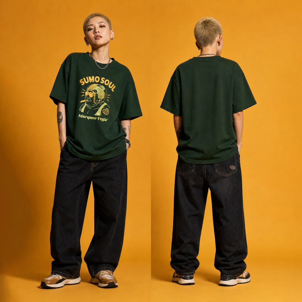 Model wearing the Sumo Soul heavyweight loose fit graphic tee in Racing Green, shown in styled product photography.